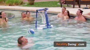 Naked brunette is craving for oral sex in this wild swinger party in the pool.