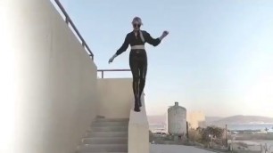 latex woman on the stairs