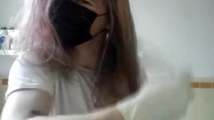 Girl Painting her Hair in Surgical Mask and Gloves