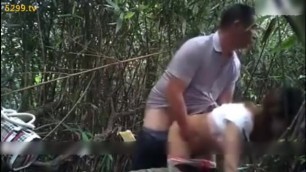 Chinese Middle Age Man in the woods having fun with MILF