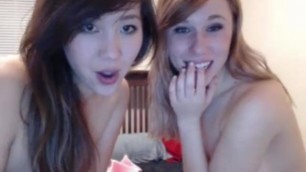Two cheerful teens kiss and lick each other in cam