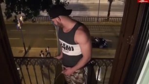 Beefy Bro Pisses on Balcony as Passersby Stroll Along the Sidewalk.