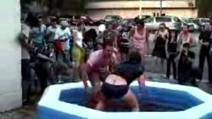 roller derby girl dominates and lifts a man in jello mixed wrestling