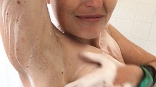 Sexy mature redhead Rachel Wriggler sets her phone up in the shower and films the entire thing for you